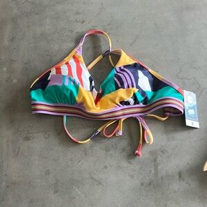 Women’s bathing suit top. Multi colored and multi patterned.